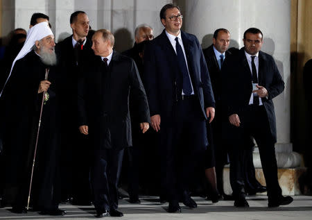 Serbian President Aleksandar Vucic, Russian President Vladimir Putin and Serbian Orthodox Church Patriarch Irinej leave the St Sava temple in Belgrade, Serbia, January 17, 2019. REUTERS/Kacper Pempel