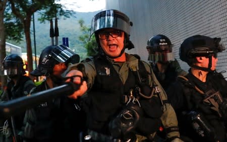 Riot police is seen near Tung Chung station, in Hong Kong