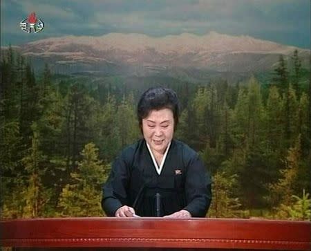 FILE PHOTO: A tearful announcer dressed in black announces the death of North Korean leader Kim Jong-il on North Korean State Television in this still image from video December 19, 2011. REUTERS/KRT via Reuters TV/File Photo