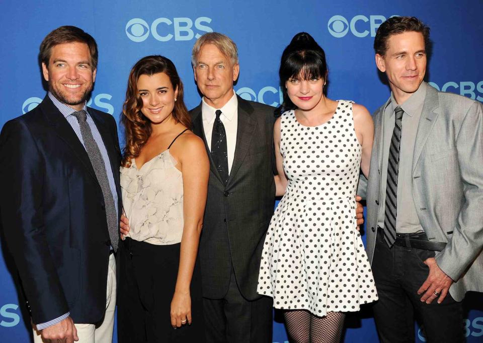 <p>Ben Gabbe/Getty</p> Left to right: Michael Weatherly, Cote de Pable, Mark Harmon, Pauley Perrette and Brian Dietzen attend CBS 2013 Upfront Presentation in New York City