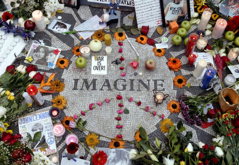 FILE PHOTO: Memorabilia lie on circle with word Imagine on it to honor deceased Lennon in Central Park's Strawberry Fields in New York