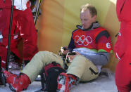 Bardonecchia, ITALY: Austria's Dieter Krassnig smokes a cigarette after the Men's Snowboard Cross small final at the Turin 2006 Winter Olympics, 16 February 2006 in Bardonecchia, Italy. US Seth Wescott won ahead of Slovakia's Radoslav Zidek and France's Paul-Henri Delerue. The Turin Winter Olympics officially opened 10 February setting the ball rolling on a 17-day festival of snow and ice sports. AFP PHOTO JOE KLAMAR (AFP via Getty Images)