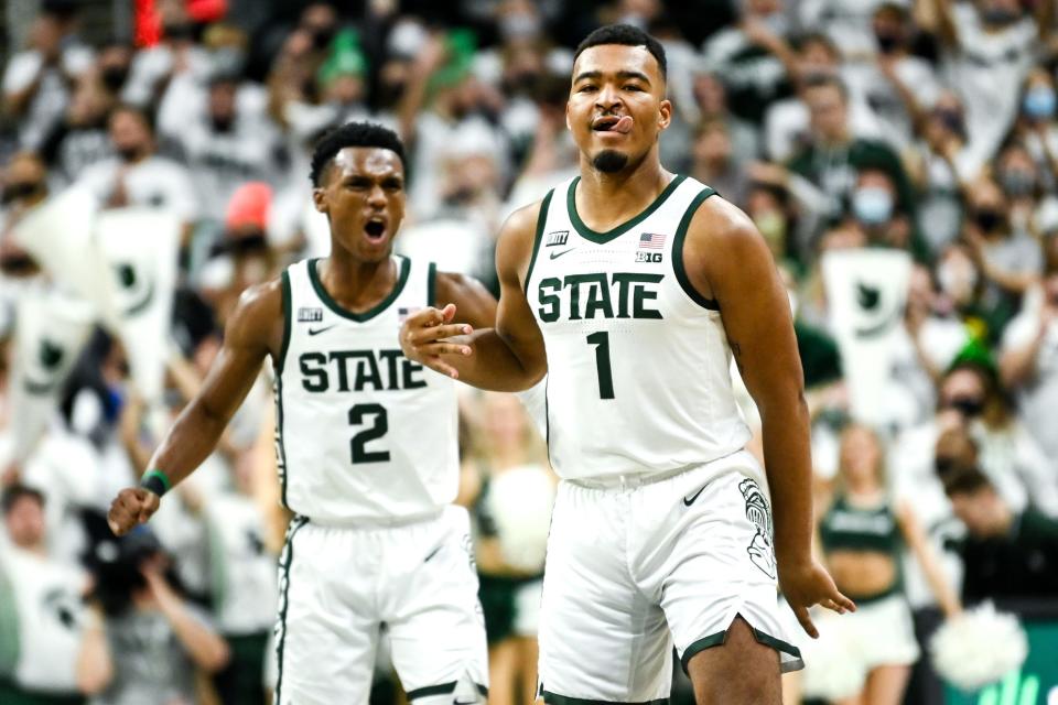 Michigan State's Pierre Brooks, right, celebrates his 3-pointer with teammate Tyson Walker during the first half in the game against Louisville on Wednesday, Dec. 1, 2021, at the Breslin Center in East Lansing.