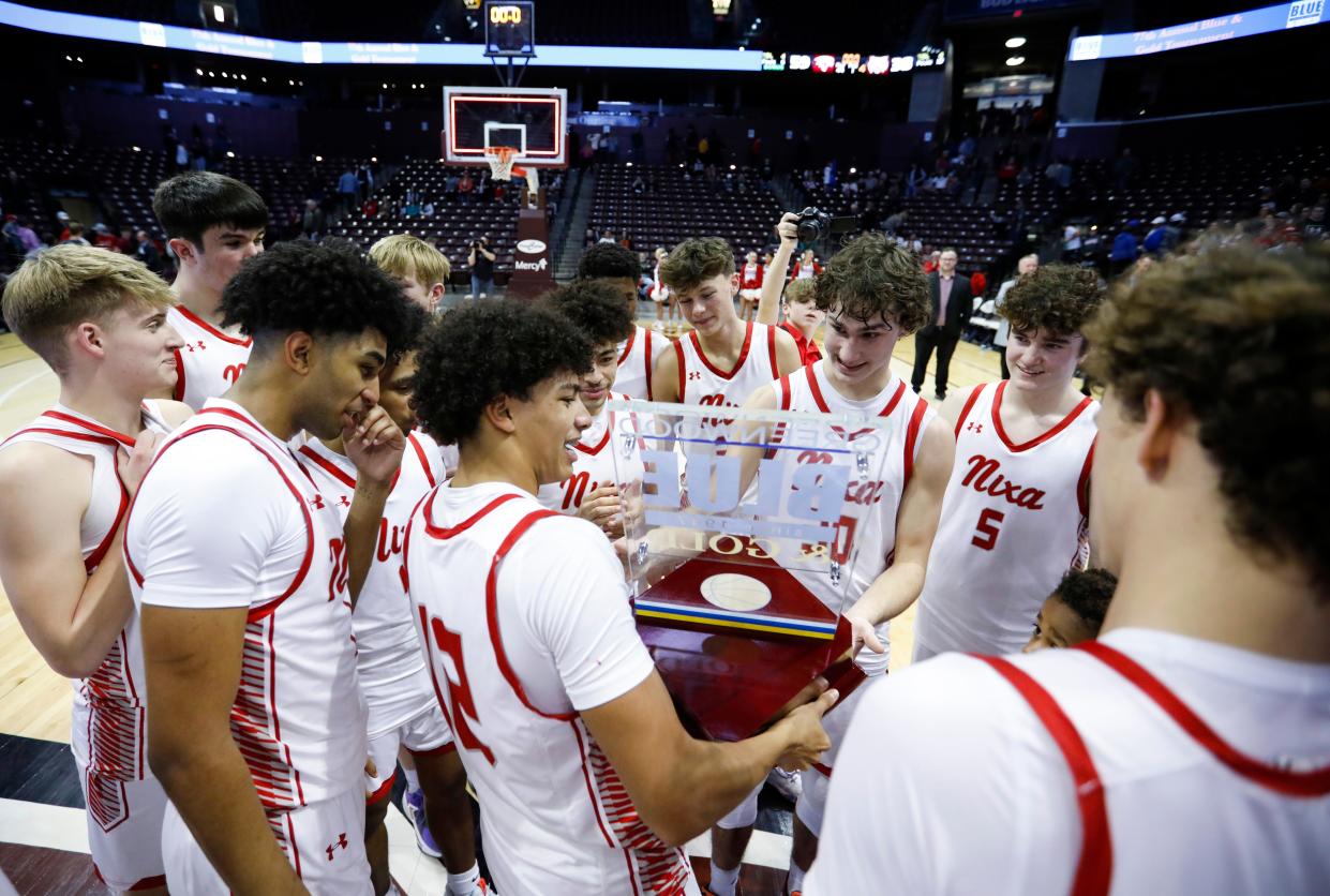 The Nixa Eagles celebrate after beating the Logan-Rogersville Wildcats in the Gold Division championship game of the 77th annual Blue & Gold Tournament at Great Southern Bank Arena on Thursday, Dec. 29, 2022.