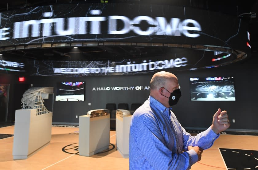 Clippers owner Steve Ballmer stands in front of a model of the Intuit Dome, the future Inglewood arena of the team.