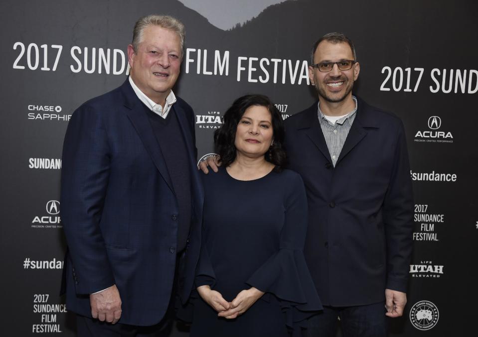 Former U.S. Vice President Al Gore, left, poses with Bonni Cohen, center, and Jon Shenk, co-directors of the film "An Inconvenient Sequel: Truth to Power," at the premiere of the film at the Eccles Theater during the 2017 Sundance Film Festival on Thursday, Jan. 19, 2017, in Park City, Utah. (Photo by Chris Pizzello/Invision/AP)