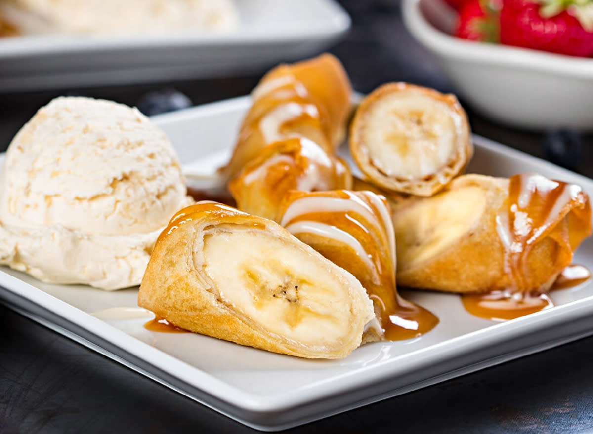 plate with p.f. chang's banana spring roll and a scoop of coconut-pineapple ice cream