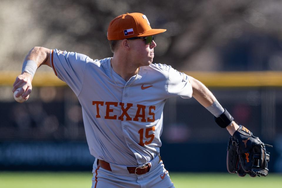 Texas third baseman Peyton Powell throws the ball to first base in the second game of the Big 12 series against Texas Tech on Saturday at Rip Griffin Park.