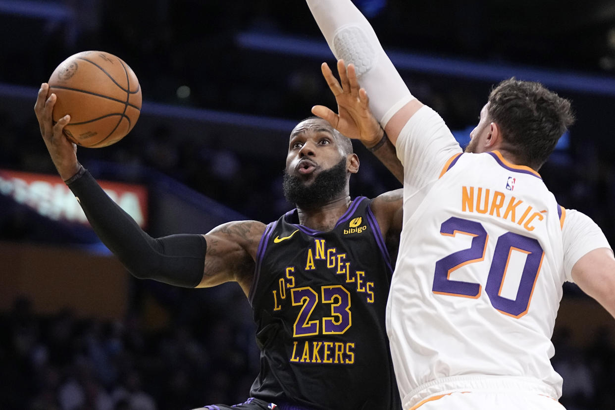 LeBron James and the Lakers are advancing after a controversial ending in in-season tournament play. (Gary A. Vasquez/Reuters)
