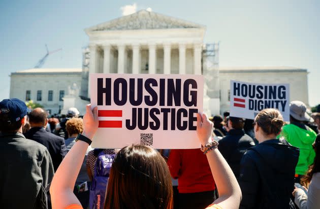 Homeless rights activists hold a rally outside of the U.S. Supreme Court on Monday as it heard arguments in City of Grants Pass v. Johnson.