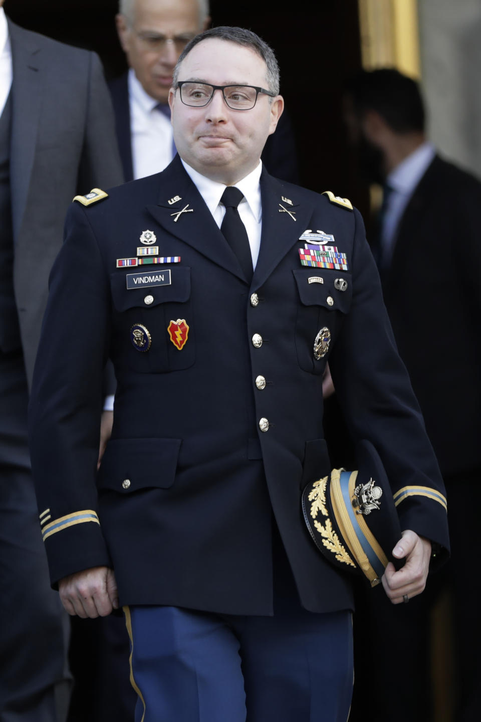 National Security Council aide Lt. Col. Alexander Vindman, leaves after testifying before the House Intelligence Committee on Capitol Hill in Washington, Tuesday, Nov. 19, 2019, during a public impeachment hearing of President Donald Trump's efforts to tie U.S. aid for Ukraine to investigations of his political opponents. (AP Photo/Julio Cortez)