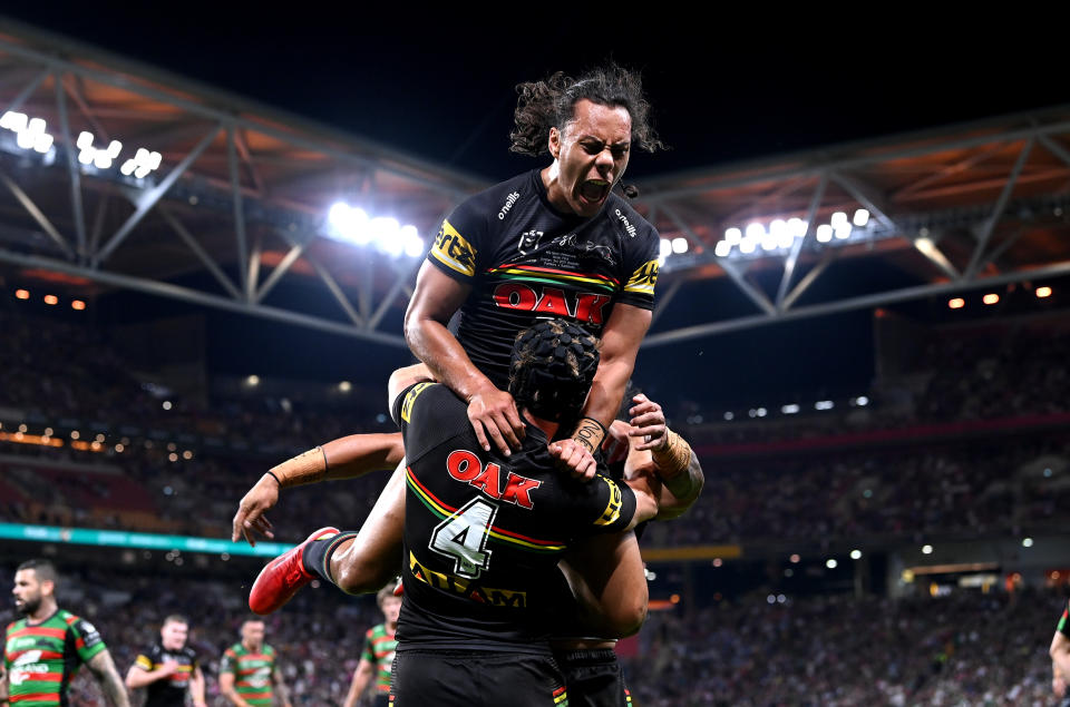 BRISBANE, AUSTRALIA - OCTOBER 03: Jarome Luai of the Panthers celebrates with Matt Burton of the Panthers after he scored a try during the 2021 NRL Grand Final match between the Penrith Panthers and the South Sydney Rabbitohs at Suncorp Stadium on October 03, 2021, in Brisbane, Australia. (Photo by Bradley Kanaris/Getty Images)