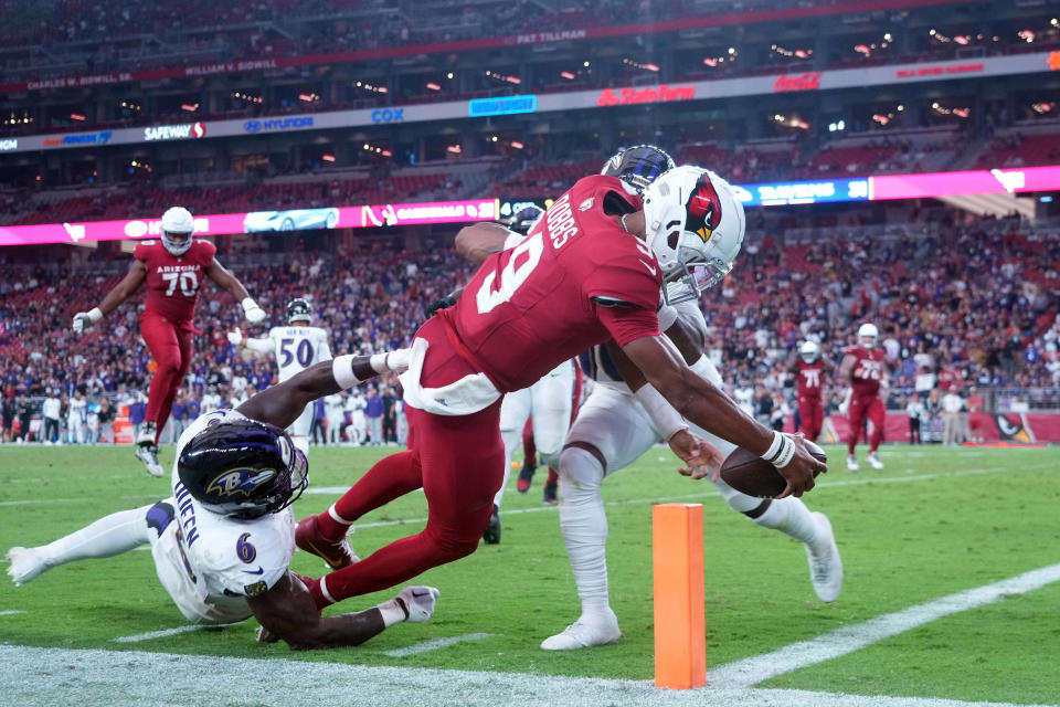 Arizona Cardinals quarterback Joshua Dobbs (9) dives in the end zone for a two-point conversion against the Baltimore Ravens.