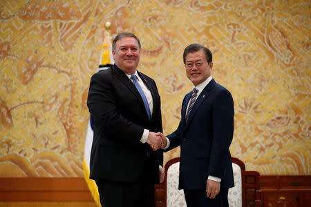 U.S. Secretary of State Mike Pompeo shakes hands with South Korea's President Moon Jae-in during a bilateral meeting at the presidential Blue House in Seoul, South Korea June 14, 2018. REUTERS/Kim Hong-ji/Pool