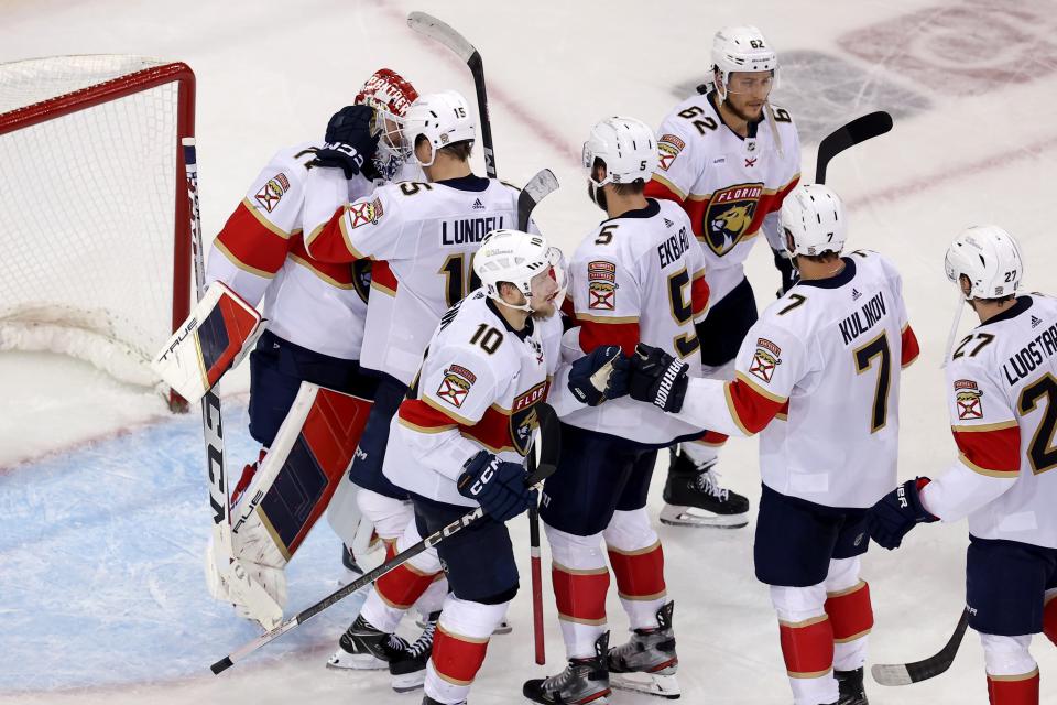 The Florida Panthers congratulate goaltender Sergei Bobrovsky (72) after a Game 5 victory against the New York Rangers.