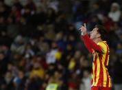 Barcelona's Lionel Messi celebrates after scoring a goal against Getafe during their Spanish King's Cup soccer match at Colisseum Alfonso Perez stadium in Getafe January 16, 2014. REUTERS/Sergio Perez