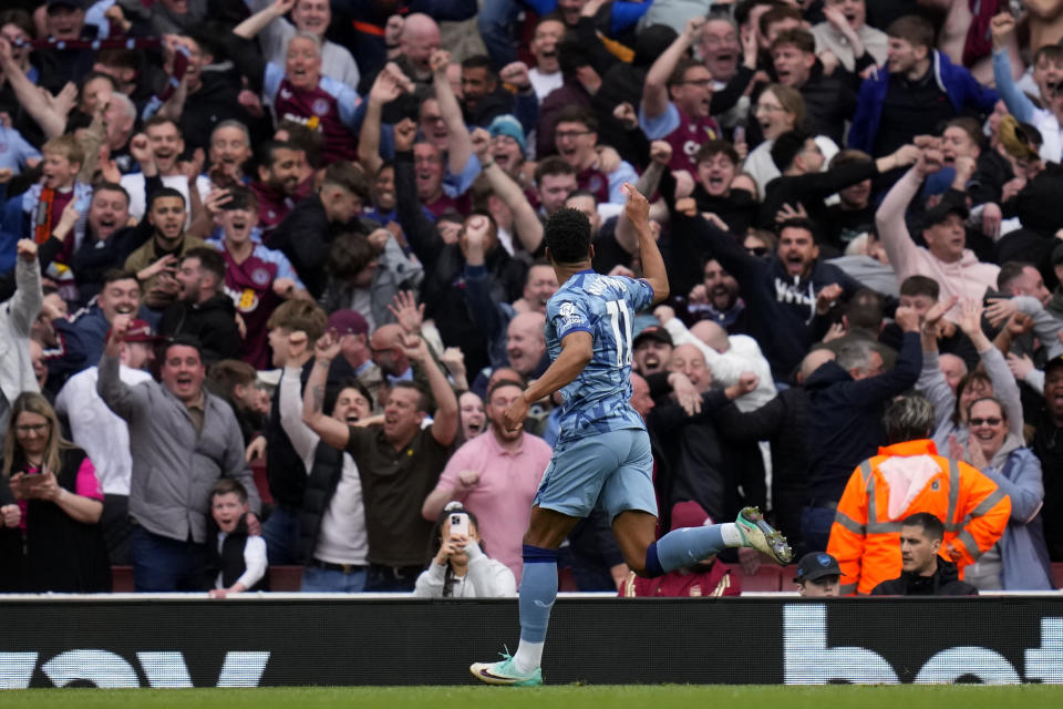 Aston Villa's Ollie Watkins celebrates after scoring his side's second goal during the English Premier League soccer match between Arsenal and Aston Villa at the Emirates stadium in London, Sunday, April 14, 2024. (AP Photo/Kirsty Wigglesworth)