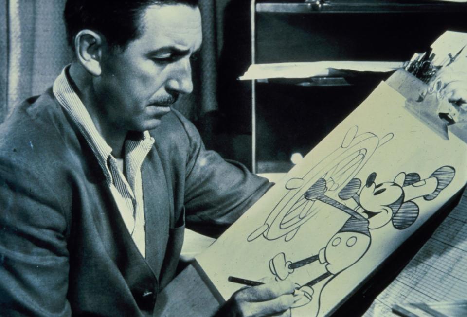 Walt Disney is pictured at the drawing board with a sketch of his famous character Mickey Mouse in this undated file photograph. The centennial of Disney's birth will be celebrated on Dec. 5, 2001, with ceremonies at Disneyland in California and Walt Disney World in Florida. Disney, the pioneering animator, theme park creator and studio founder died in Burbank, Calif., on Dec. 16, 1966.