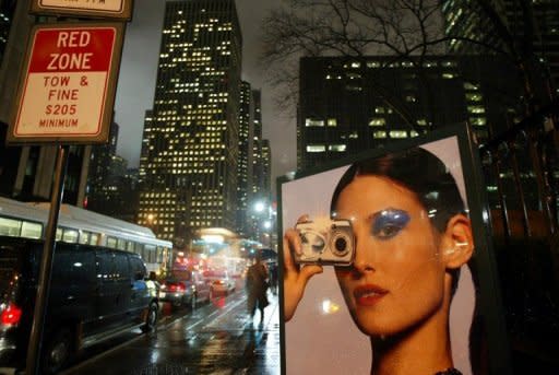 This file photo shows an Olympus advertisement on a street in New York. Japan's Olympus said it had stripped the company's first ever non-Japanese president of his title, just six months after appointing him and only two weeks after he was also named chief executive