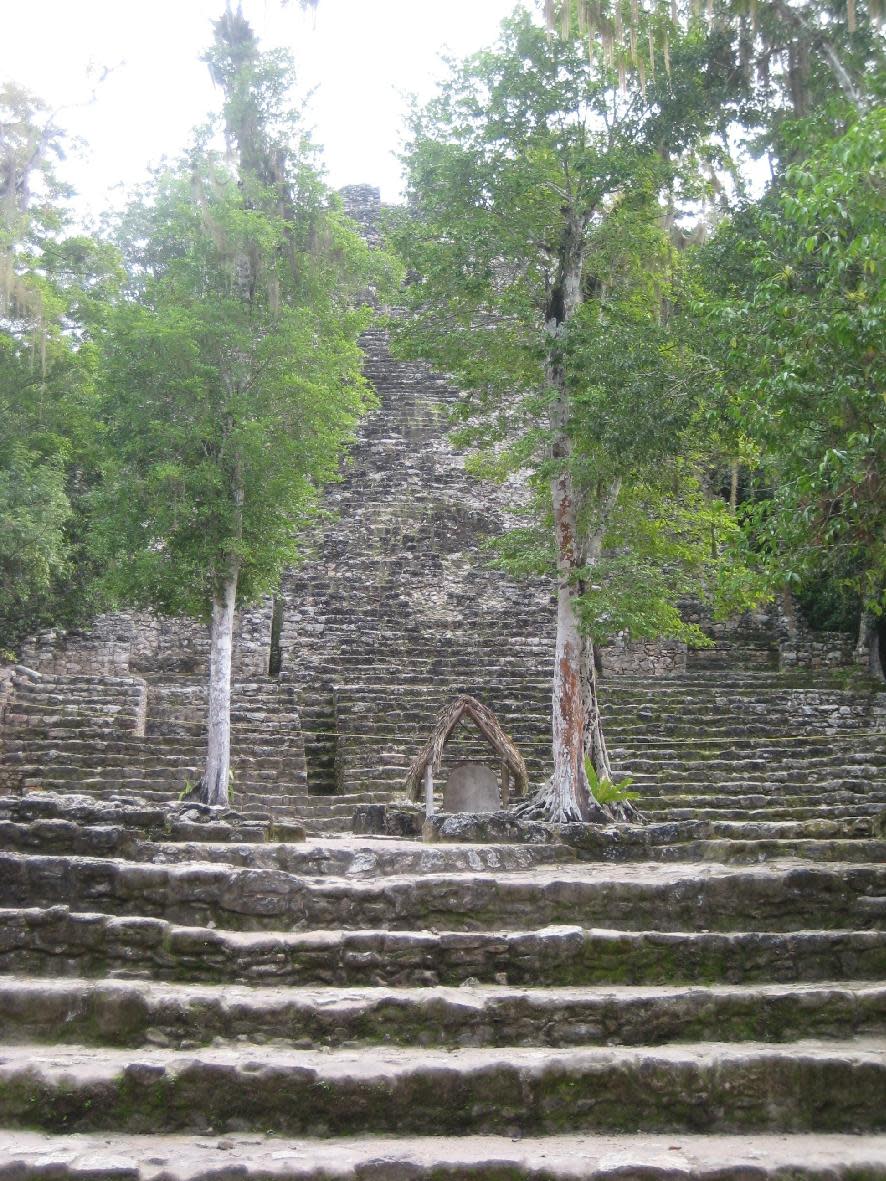 This December 2011 photo shows a small pyramid at the Mayan ruins in Coba, about 27 miles northwest of Tulum. At the civilization's height in A.D. 500-900, Coba was home to an estimated 50,000 residents and covered 50 miles. (AP Photo/Kim Curtis)