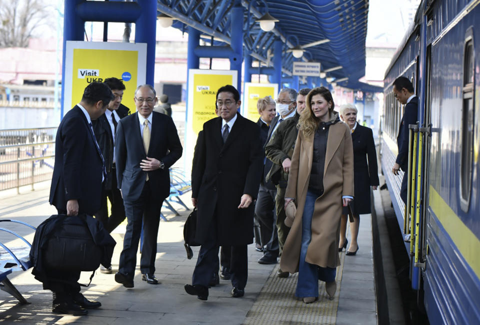 Japanese Prime Minister Fumio Kishida, center, and Emine Dzhaparova, First Deputy Foreign Minister of Ukraine, right, at the railway station in Kyiv, Ukraine, Tuesday, March 21, 2023. (Ukrainian Presidential Press Office via AP)