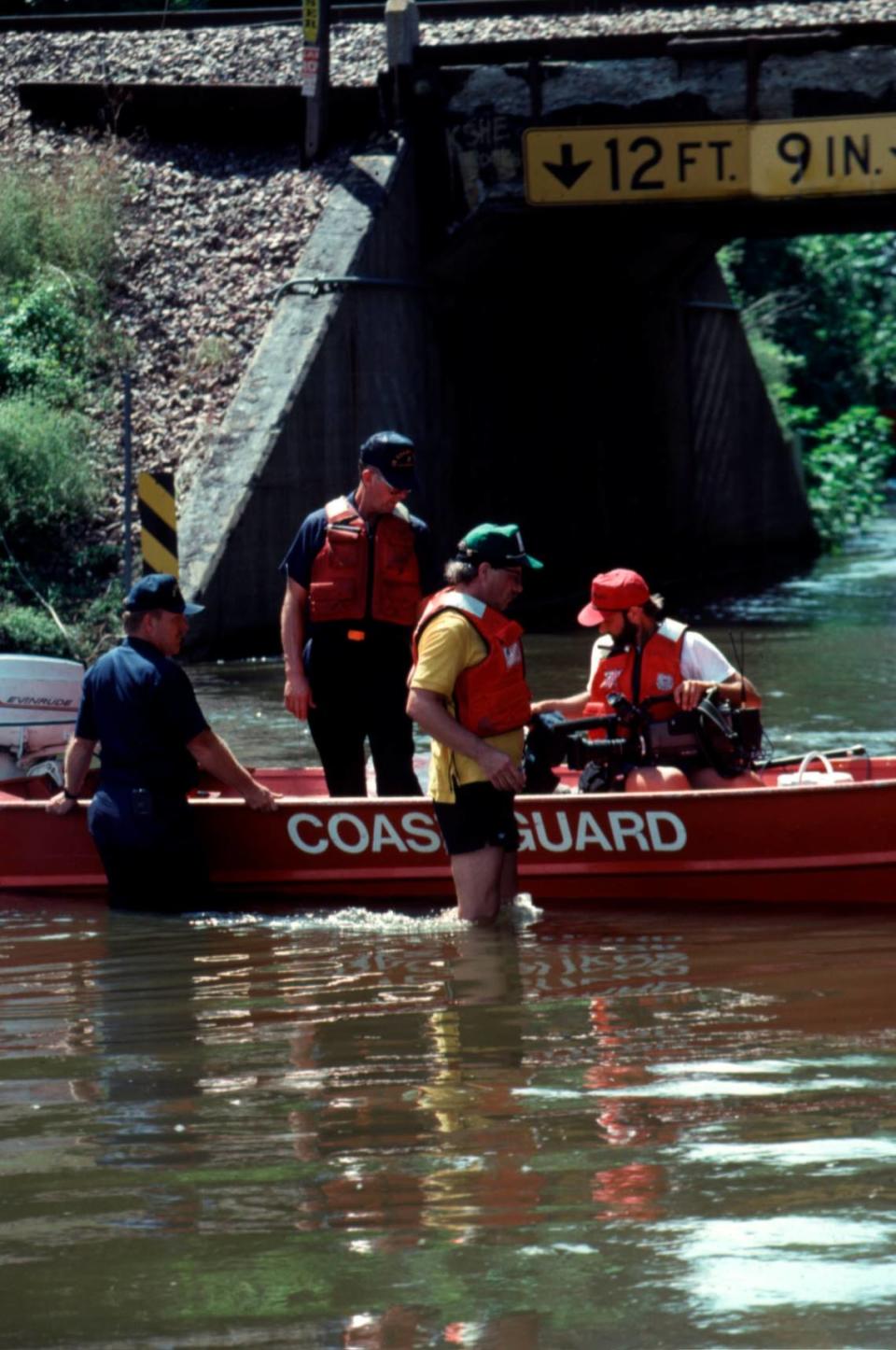 Flood victims are being taken to safe ground after their homes flooded out during the great 1993 Midwest Flood on July 7, 1993. U.S. Coast Guard
