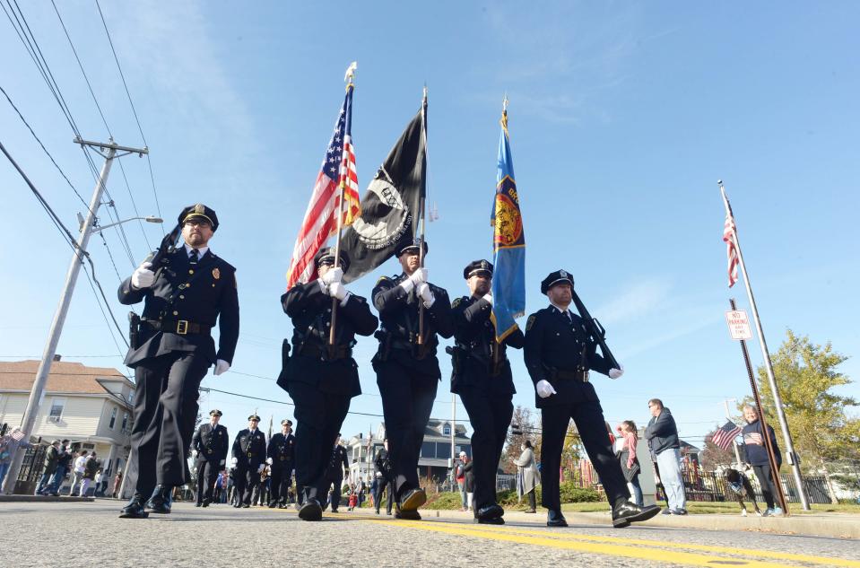 The Brockton Police Department Color Line marches in the Brockton Veterans Day Parade on Thursday, Nov. 11, 2021.