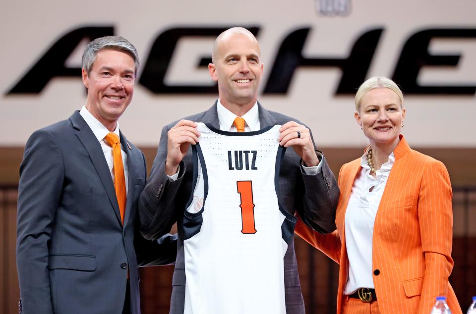 OSU athletic director Chad Weiberg, left, and President Dr. Kayse Shrum introduce men's basketball coach Steve Lutz on Thursday afternoon at Gallagher-Iba Arena in Stillwater.