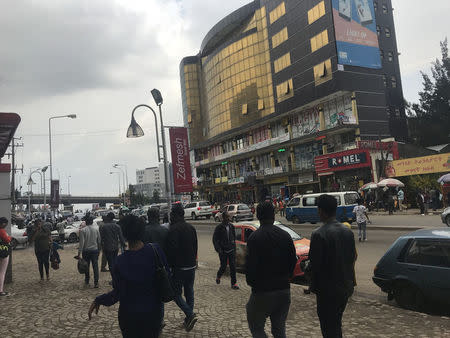 People walk past shops in Addis Ababa, Ethiopia, July 19, 2018. REUTERS/Maggie Fick