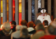 Pope Francis attends the rite of the washing of the feet at the Don Gnocchi Foundation Center for assistance to disabled and elderly, in Rome, Thursday, April 17, 2014. The Pontiff has washed the feet of 12 elderly and disabled people — women and non-Catholics among them — in a pre-Easter ritual designed to show his willingness to serve like a "slave." Francis' decision in 2013 to perform the Holy Thursday ritual on women and Muslim inmates at a juvenile detention center just two weeks after his election helped define his rule-breaking papacy. It riled traditionalist Catholics, who pointed to the Vatican's own regulations that the ritual be performed only on men since Jesus' 12 apostles were men. The 2014 edition brought Francis to a center for the elderly and disabled Thursday. Francis kneeled down, washed, dried and kissed the feet of a dozen people, some in wheelchairs. He said the ritual is a gesture of "a slave's service." (AP Photo/Riccardo De Luca)