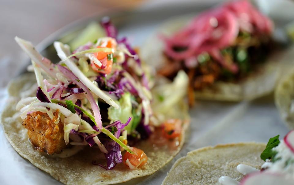 Bakersfield Tacos' fish taco with crispy mahi, tabasco lime sauce, citrus slaw, cilantro. 