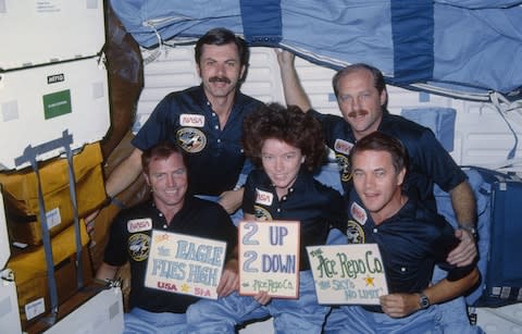 The Discovery crew celebrating a successful mission - Credit: NASA/JSC