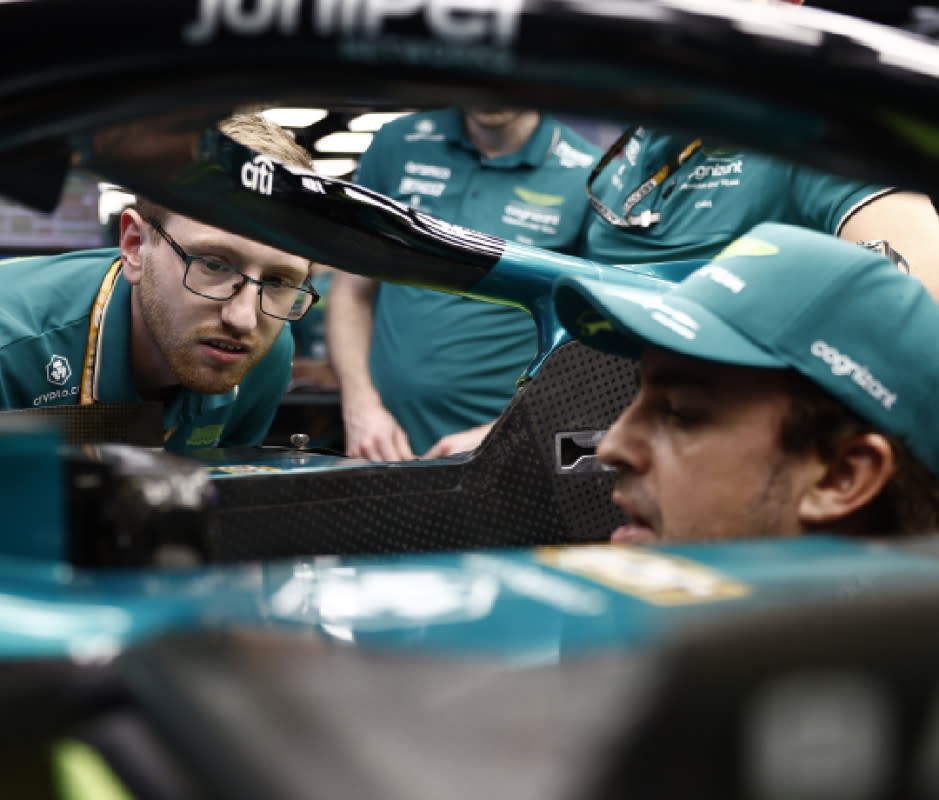 <em>Formula 1 driver Fernando Alonso speaks with his technicians at the Austin Grand Prix.</em><p>Courtesy Image</p>
