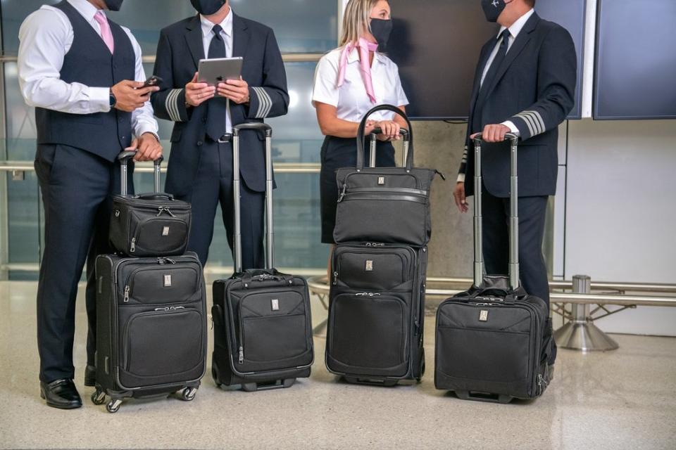 Flight crew with black Travelpro Luggage