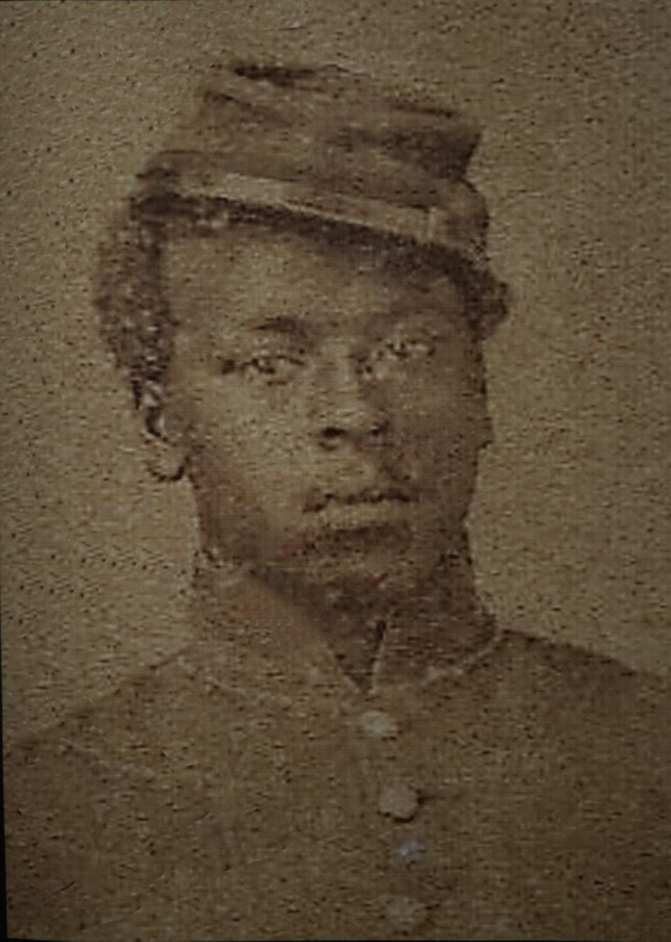 A photo of Civil War veteran Sgt. Hiram White of the 25th U.S. Colored Infantry Regiment of the U.S. Army taken by his commanding officer after White and 16 other soldiers helped nurse their gravely ill commander back to health during battle.