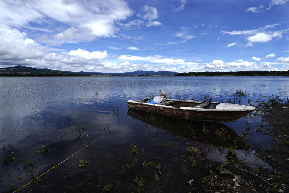 A boat is tied to the shore of the Villa Victoria reservoir in the state of Mexico, Tuesday, Oct. 10, 2023. The capital’s reservoirs like Villa Victoria are running historically low following a “too dry” summer, according to official data, and as the rainy season draws to a close, water restrictions have already begun. (AP Photo/Marco Ugarte)