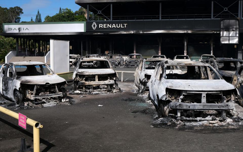 Cars at a Renault dealership in the Magenta district in Noumea were torched during the protests