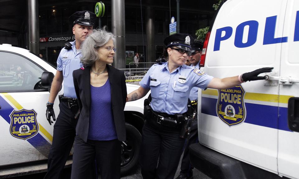 Green Party presidential nominee Jill Stein, is transported in restraints to be arrested after a sit-in at a downtown Philadelphia bank over housing foreclosures. Wednesday, Aug. 1, 2012, in Philadelphia. About 50 Green Party supporters hope to protest at Fannie Mae. (AP Photo/Brynn Anderson)