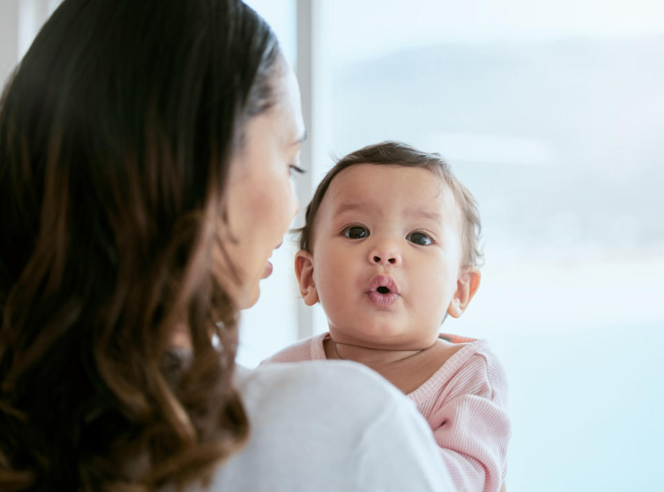 A woman holding a baby