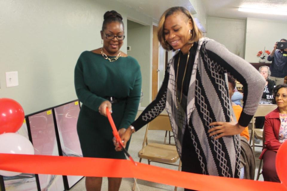 Pamela Davis, left, CEO of the Gainesville Housing Authority, and Angela Tharpe, right, chair of the GHA board of directors, cut the ribbon during GHA's Home Goods Re-Sale Store's grand opening.
(Photo: Photo by Voleer Thomas/For The Guardian)