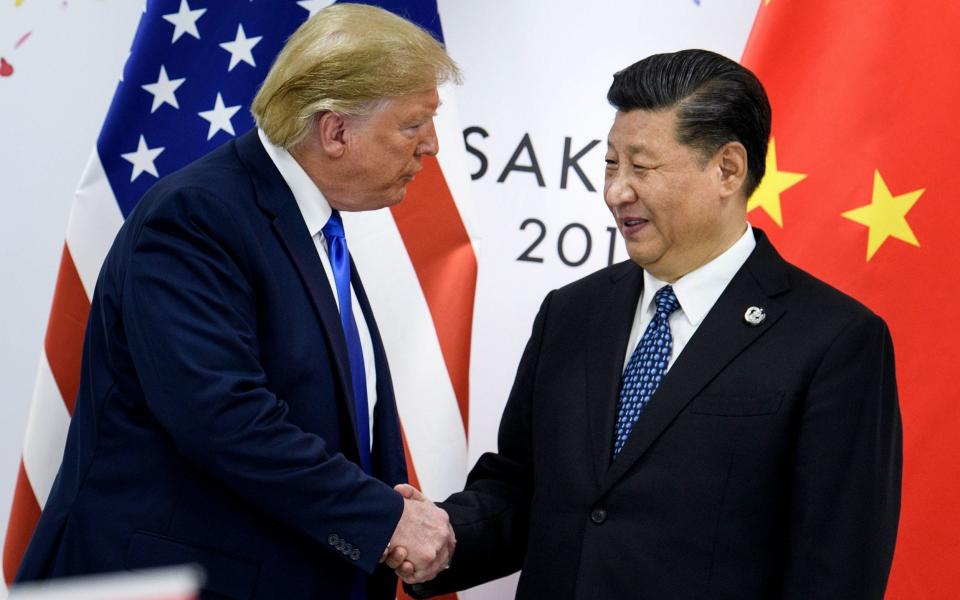 Xi Jinping with Donald Trump before a bilateral meeting on the sidelines of the G20 Summit in Osaka - AFP