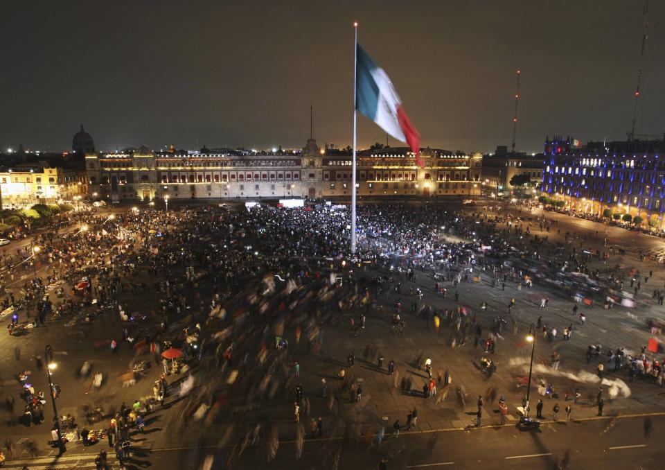 Demonstrators arrive at Zocalo Square during a protest in support of the 43 missing Ayotzinapa students in Mexico City