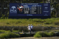 Louis Oosthuizen, of South Africa, walks with his caddie on the bridge to the 13th hole during the second round of the PGA Championship golf tournament on the Ocean Course Friday, May 21, 2021, in Kiawah Island, S.C. (AP Photo/David J. Phillip)