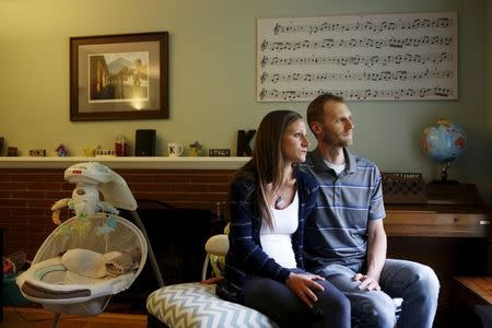 Emily and Matt Knudsen sit in their living room in their home in Fremont, California, May 14, 2015. REUTERS/Beck Diefenbach