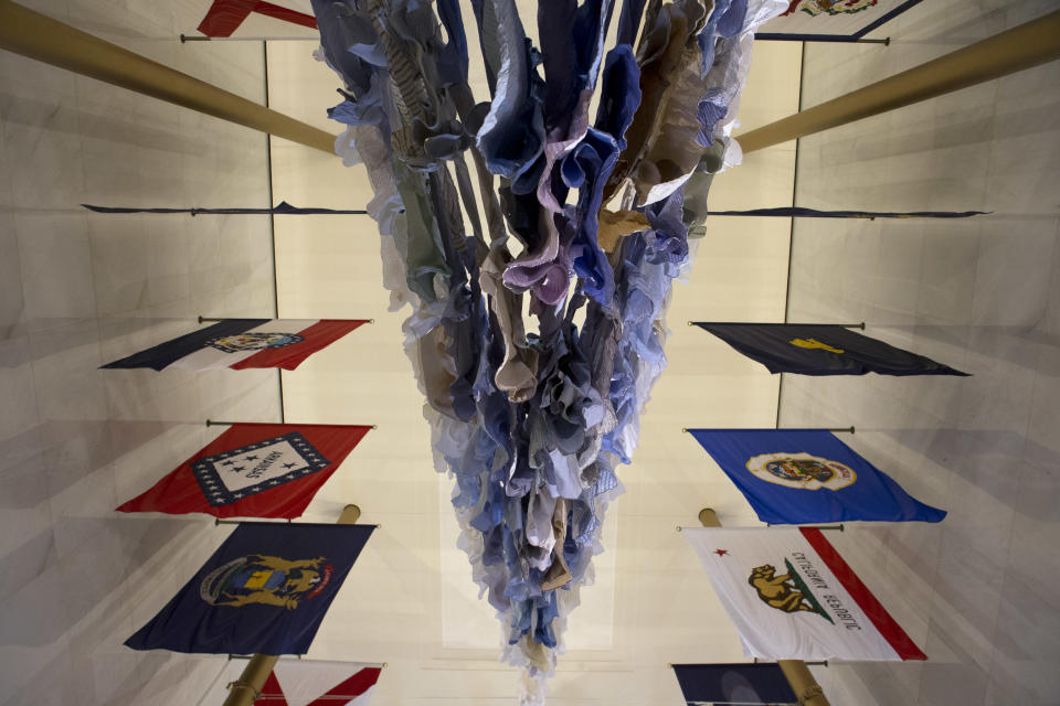 This photo taken Feb. 19, 2013 shows the installation "Are We Still Afloat," by artist Kaarina Kaikkonen, of Finland, from below, in the Hall of States during a media preview of "Nordic Cool," an international festival being held at the Kennedy Center in Washington. More than 700 artists from Denmark, Finland, Iceland, Norway and Sweden, as well as Greenland, the Faroe Islands and the Aland Islands will present their work in theater, dance, music, visual arts, design, film, architecture and cuisine. (AP Photo/Jacquelyn Martin)