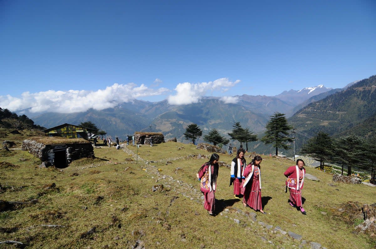 Arunachali tribal women visit bunkers from the Indo-China war at a war memorial in Jaswant Garh in Arunachal Pradesh near the Indo-China border in 2012 (AFP via Getty Images)