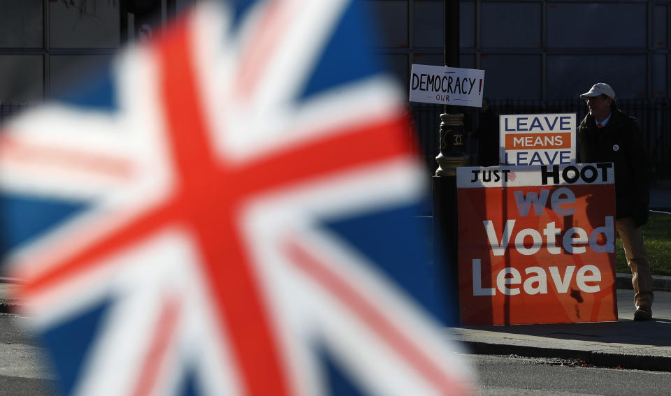 A Brexit supporter waits by the road side as he demonstrates outside the Houses of Parliament in London, Monday, Jan. 28, 2019. Pro-Brexit British lawmakers were mounting a campaign Monday to rescue May's rejected European Union divorce deal in a parliamentary showdown this week. (AP Photo/Alastair Grant)