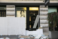 The windows of a Chanel store are broken Monday, June 1, 2020, following protests in the SoHo neighborhood of New York. Protests were held throughout the country over the death of George Floyd, a black man who died after being restrained by Minneapolis police officers on May 25. (AP Photo/Mark Lennihan)