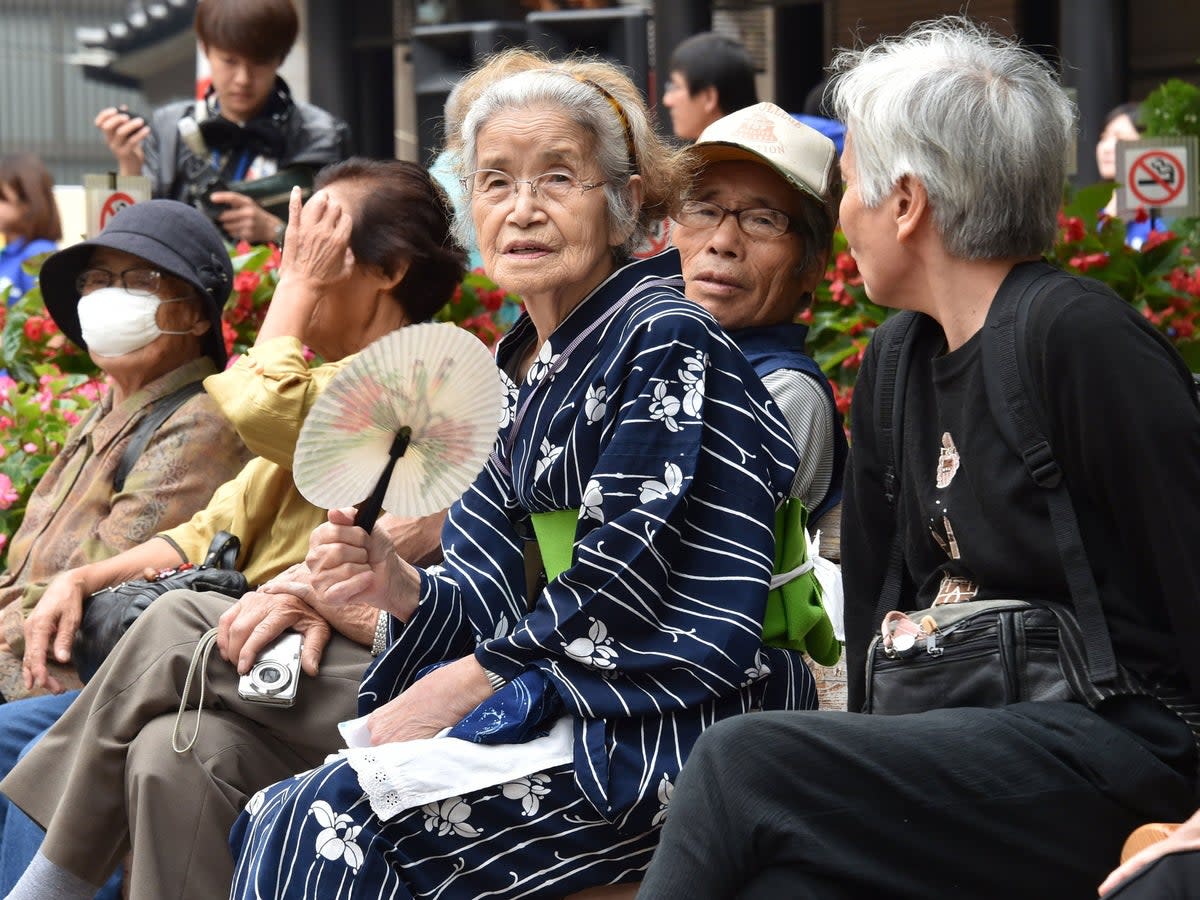 File. Elderly residents rest in the grounds of a temple in Tokyo, Japan  (YOSHIKAZU TSUNO/AFP/Getty Images)