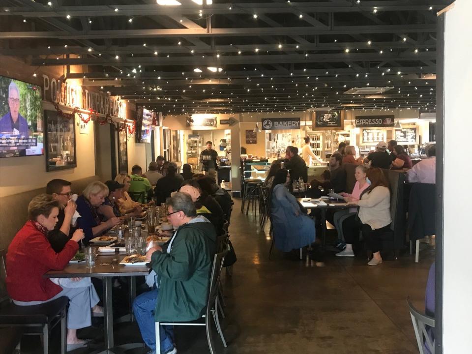 A busy dining room at Brues Alehouse in February 2022.